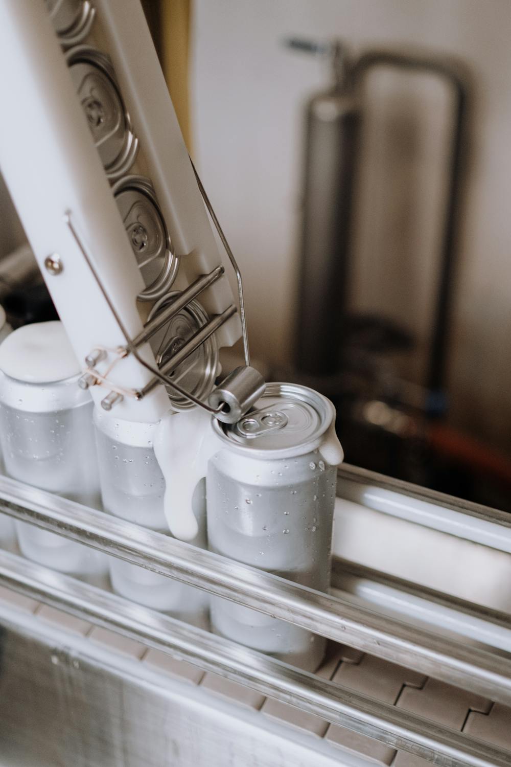 Food containers being processed on a modern production line in a manufacturing facility